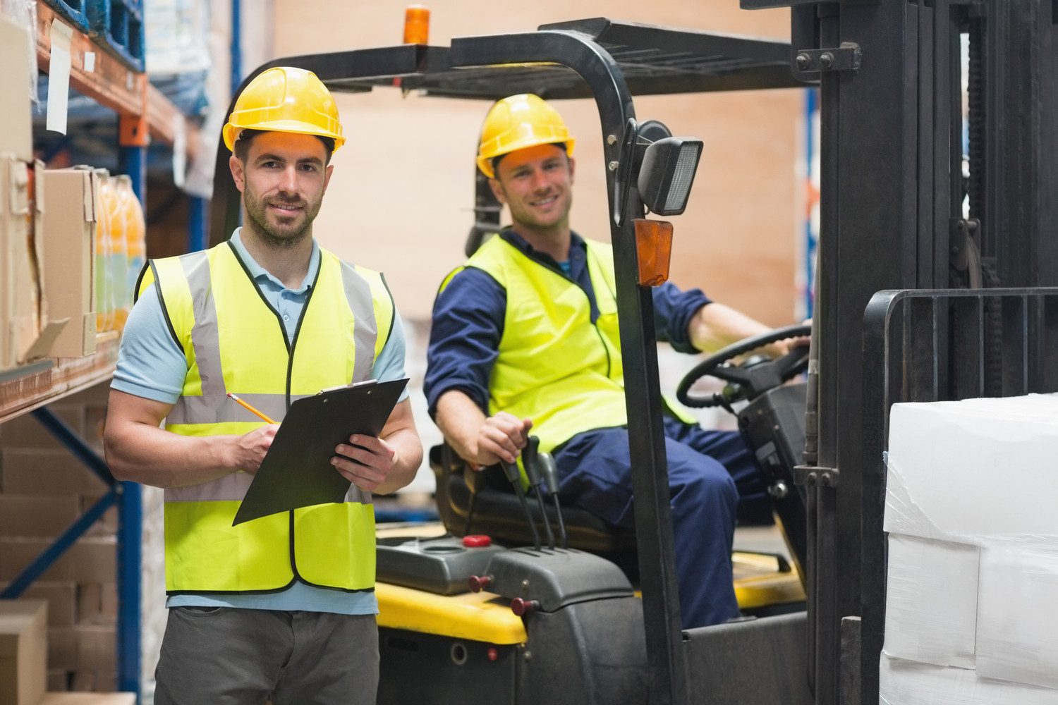 Smiling,Warehouse,Worker,And,Forklift,Driver,In,Warehouse